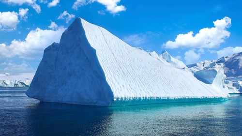 Boat excursion near icebergs of Kangia Fjord and Sermeq Kujalleq glacier in Ilulissat, Greenland,