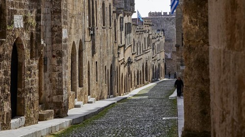 A medieval street with cobblestones and historic stone buildings, quiet atmosphere, Knights Street,