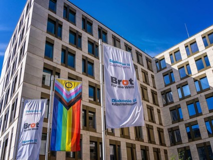 Flags in front of the office of Bread for the World, Berlin-Mitte, Germany, Europe