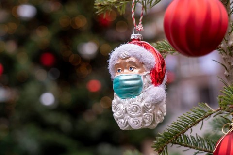 Symbolic image of Christmas in the Corona crisis, Father Christmas figure, Christmas tree