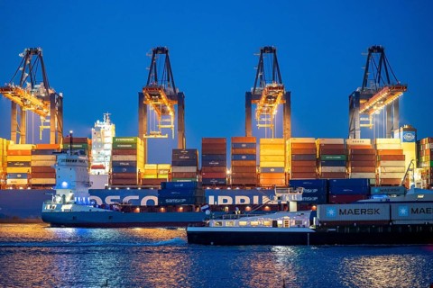 Container ship of the shipping company Cosco Shipping, CSCL SATURN, being loaded and unloaded,