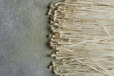 Enoki mushrooms, raw, top view, close-up