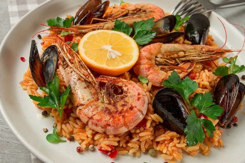 Seafood paella, shrimp and mussels risotto, rice, homemade, top view, no people