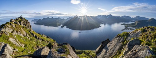 Panorama, view of Fjord Raftsund and mountains in the evening light, sun star, summit of