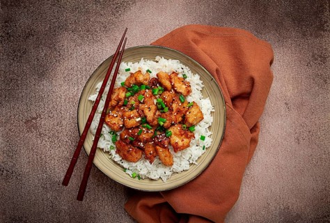 Fried chicken teriyaki with rice, green onion and sesame, homemade, no people