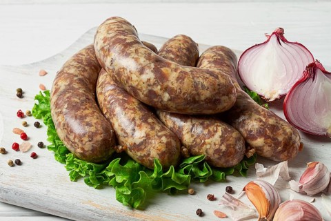 Raw kupaty, traditional Georgian sausages, raw sausages, with spices and herbs, Georgian cuisine