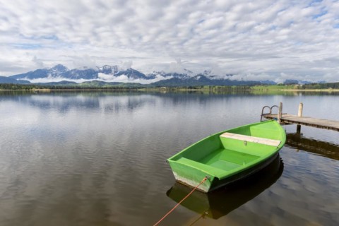 Rowing boat at sunrise, Hopfensee, Hopfen am See, near Füssen, OstallgÃ¤u, AllgÃ¤u, Bavaria,
