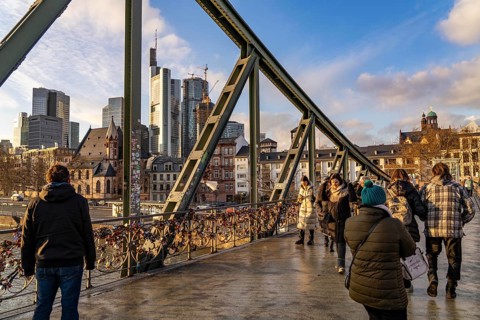 Skyline of the city centre of Frankfurt am Main, river Main, Eiserner Steg bridge, dusk, Hesse,