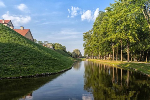 Ancient restored castle with a moat in the Nesvizh city. Belarus