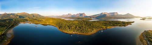 Panoramic aerial view over the fjord Efjord south of Narvik, seen at sunset, leisure boats anchor,