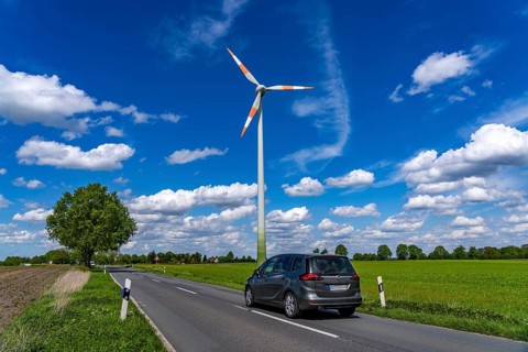 Wind turbine, wind energy plant from the manufacturer Enercon, blue sky with many white clouds,
