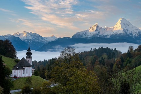 Maria Gern pilgrimage church at sunrise, behind Schönfeldspitze and the Watzmann, in autumn,