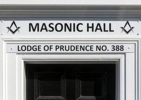 Sign above doorway entrance to Masonic Hall, Lodge of Prudence number 388, Halesworth, Suffolk,