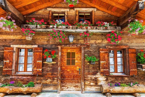 Old wooden house with floral decorations, historic village centre, Grimentz, Val d'Anniviers,