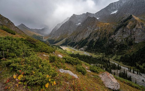 Green mountain valley with river and steep mountain peaks, Chong Kyzyl Suu Valley, Terskey Ala Too,