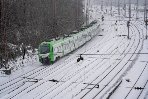 Onset of winter with lots of fresh snow and temperatures below -5 degrees during the day, railway