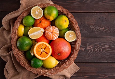 Assortment, citrus fruits, in a basket, close-up, top view, no people