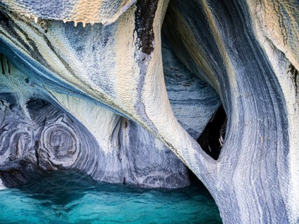 Inside the marble caves near Puerto Rio Tranquilo, small sightseeing boats explore single areas of