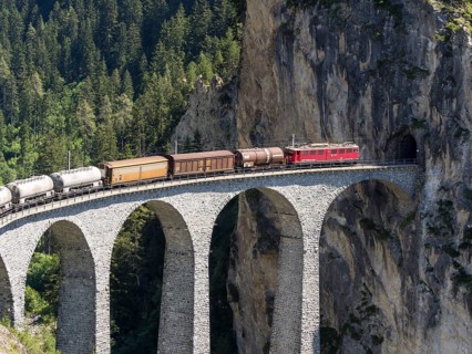 Freigth train passing the Landwasserviadukt near Filisur, Switzerland, Europe