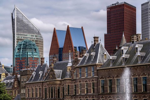 The historic Binnenhof, seat of the Dutch government, Hofvijver pond, skyline of the city centre at