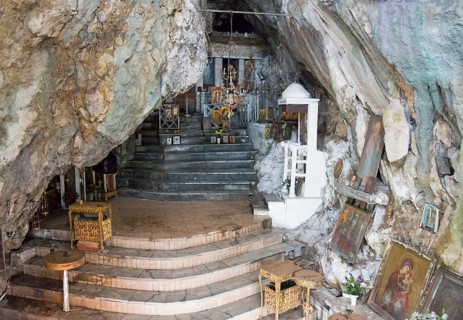 Interior view of a chapel built into the cave with steps and candles, rock church of Smerna, Church
