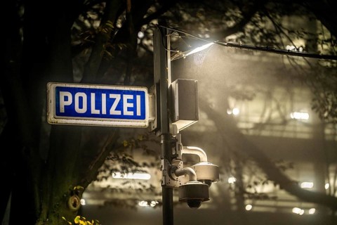 Illuminated sign for a police station, surveillance cameras for the police station car park, North