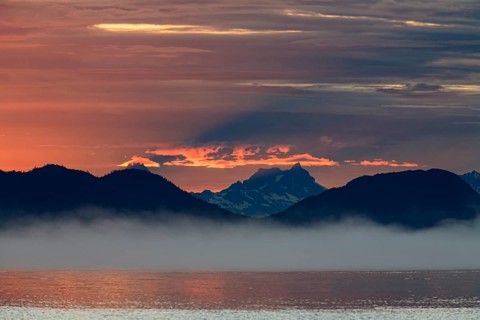 Clouds and sunset over the sea, mountain landscape, fog, Juneau, Southeast Alaska, Alaska, USA,