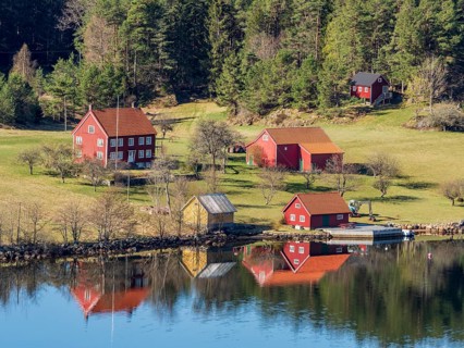 Farm with red houses on an island near Risor, norwegean southern coast, Norway, Europe