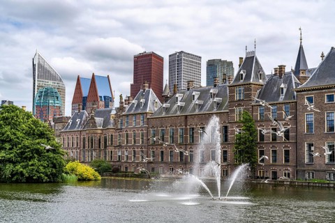 The historic Binnenhof, seat of the Dutch government, Hofvijver pond, skyline of the city centre at