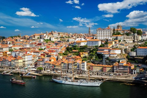Aerial view of Porto city and Douro river with moored sailling ship from Dom Luis bridge I. Porto,