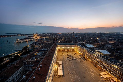 Evening atmosphere, illuminated Basilica di Santa Maria della Salute and St Mark's Square, view