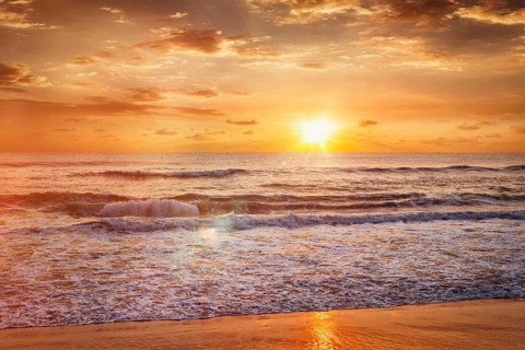 Beach holidays vacation background, peaceful serene morning sunrise on beach. Chennai, India, Asia
