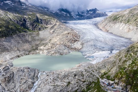 Drone shot of melting Rhone glacier, glacial lake, origin of Rhone river, Switzerland, Europe