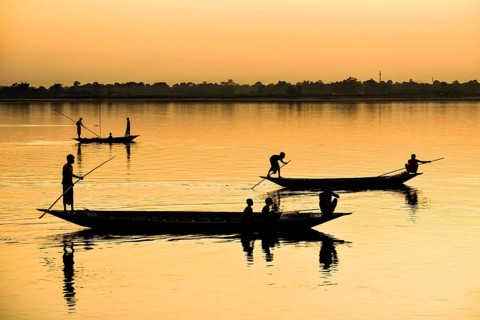 Fishermen fishing in Beki river during sunset, in Barpeta district of Assam, India on 01 Nov. 2019