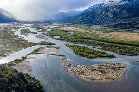 The widely branching arms of river Rio Ibanez, near Villa Cerro Castillo, aerial view, snow-capped