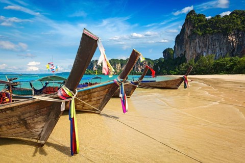 Long tail boats on tropical beach (Railay beach) in Thailand