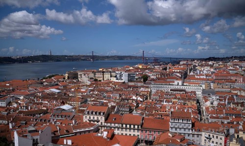 View from Castelo de Sao Jorge to old town, city view, river Rio Tejo, bridge 25 de Abril, Lisbon,