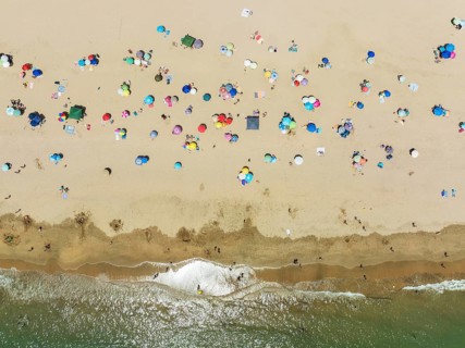 Beach life at the Atlantic Ocean near Punta Umbria. Aerial view. Drone shot. Huelva province,