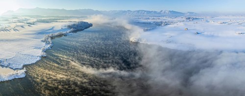 Aerial view of a lake in front of mountains, winter, snow, morning light, fog, panorama, Riegsee,