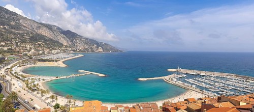 Scenic panoramic view of Menton seashore promenade and historic city in French Riviera Cote D azur