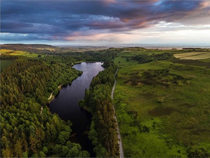 Sunset over Cod Beck Reservoir from a drone, North York Moors National Park, North Yorkshire,