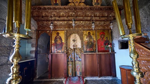 Gilded altar area with icons of saints and candlesticks, Monastery of Apokalipsis, Patmos,