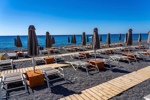 Beach, empty, organised, with sun loungers and parasols, catering, bay at Koutsounari Beach, on the