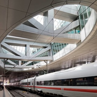 ICE at the centre platform with the large opening to the glass dome, long-distance train station,