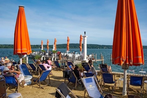 Sandy beach beach with deckchairs, lakeside restaurant, former Undosa wave pool, now H'ugo's Beach