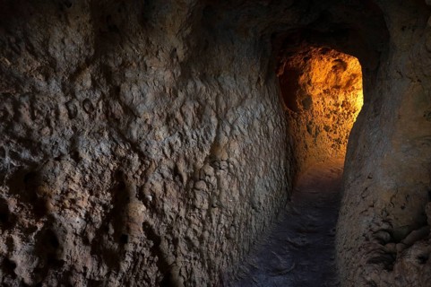 Light at the end of the tunnel, Algar Seco rock formation, coloured rocks and underground caves,