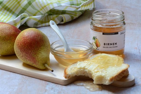 Pear jelly in a bowl and glass, pear jelly on a slice of bread