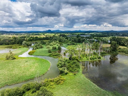 Aerial view of the Radolfzeller Aachried with the Radolfzeller Aach at high water, on the horizon