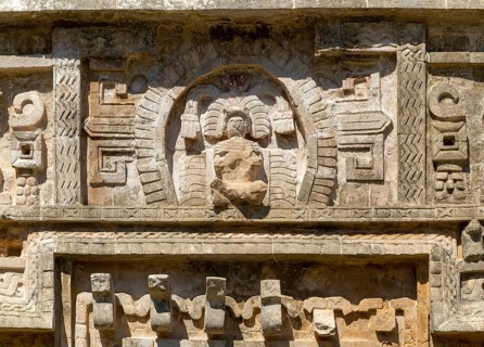 Detail of elaborate decorated stone facade in Monjas complex, Chichen Itza, Mayan ruins, Yucatan,