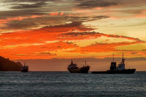 Fisher boats in sea in twilight, sunset. San Vincente. Mindelo. Cabo Verde. Africa